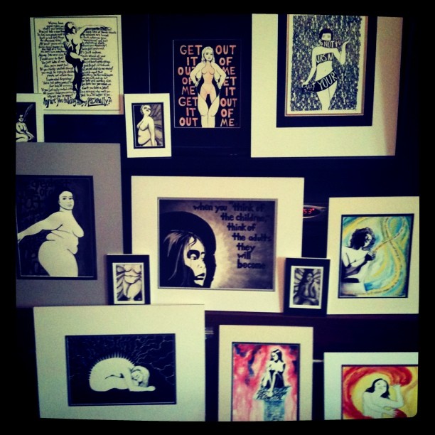 A collection of 13 paintings of various sizes, all matted and prepped for show.
